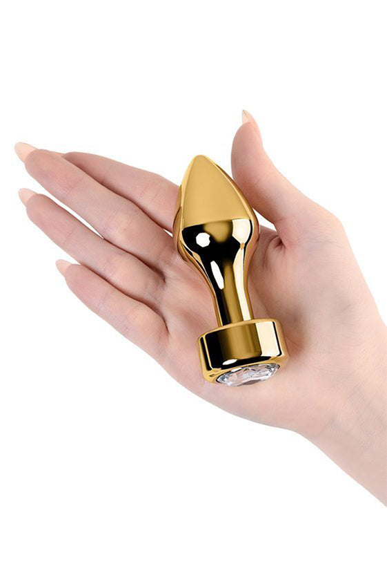 Plug anal en métal doré Toyfa avec pierre acrylique blanche 7cm